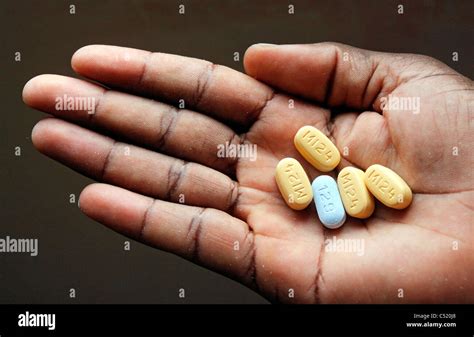 Hand with five tablets high-measured ARV Antiretoviral Medicine Stock ...