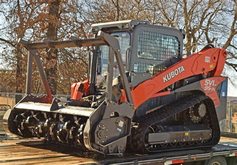 Kubota SVL 95 2S skid steer and forestry mulcher