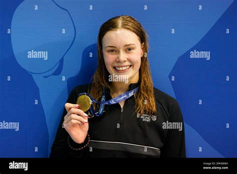 Katie Shanahan poses with her medal after winning the Women 200m ...