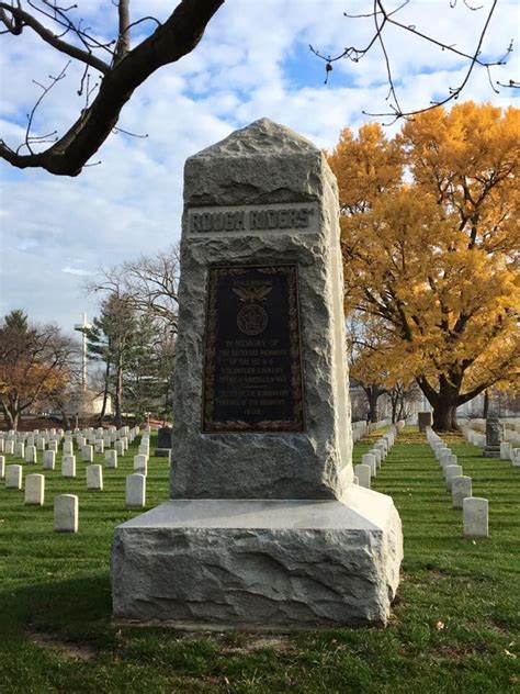 a large stone monument sitting in the middle of a grass covered field ...