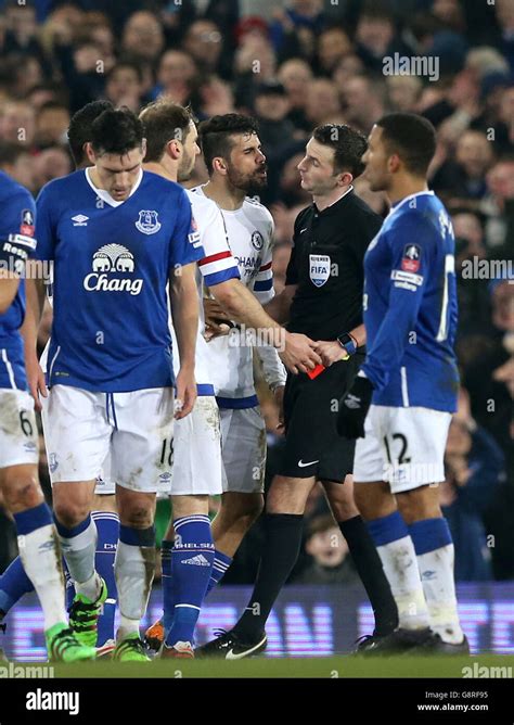 Chelsea's Diego Costa is shown the red card by referee Michael Oliver ...