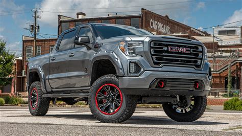 GMC BLACK WIDOW LIFTED TRUCKS — SCA Performance | Black Widow Lifted Trucks