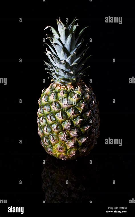 Pineapple with black background Stock Photo - Alamy