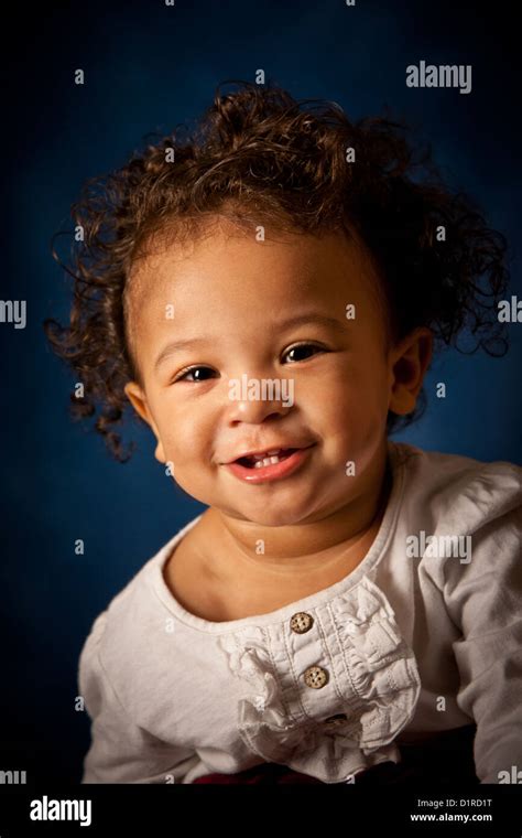 Studio portrait of a cute baby girl, 18 months, mixed race Stock Photo - Alamy