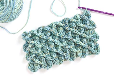 Learn how to work the crocodile crochet stitch and add scale-like ruffles to hats, cuffs, cowls ...