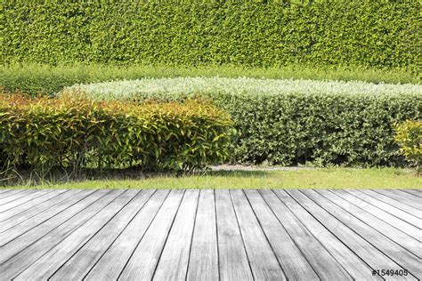 Old dark wood table or floor in garden with green - stock photo 1549405 ...