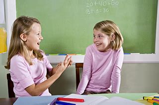 two girls chatting in class