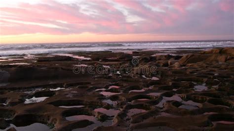 Eroded Tide Pool Rock Formation in California. Sunset Sky Reflection in Water. Stock Footage ...