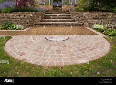 Pebble mosaic, paving, plants, steps, stone wall and terracing - traditional, designed ...