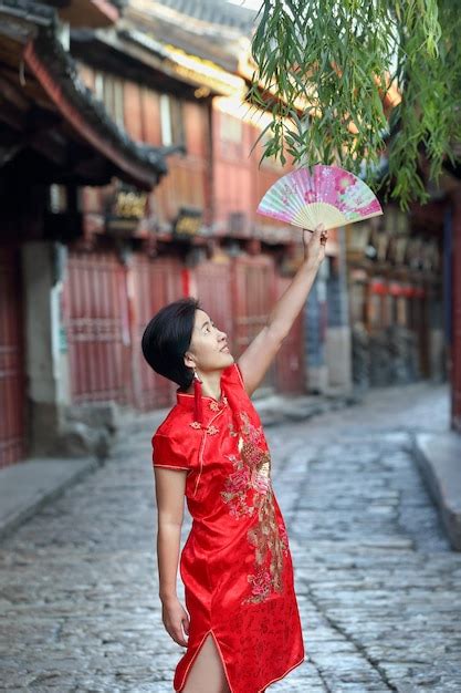 Premium Photo | Female tourist with chinese traditional clothing in ...