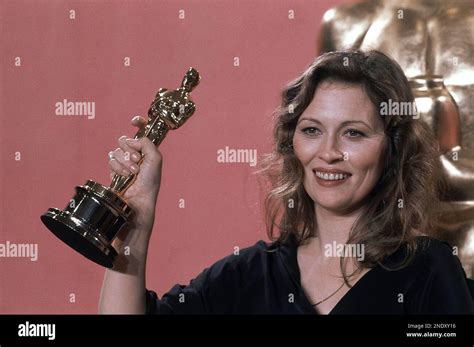 Faye Dunaway, holds the Oscar she won for best actress in "Network," at ...