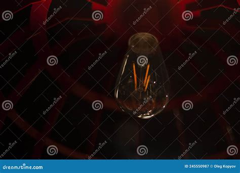 Light Bulb in the Interior. Light Bulb in a Dark Room Stock Image ...