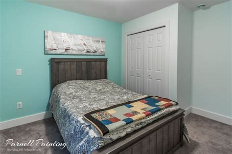 light blue master bedroom with turquoise accent wall