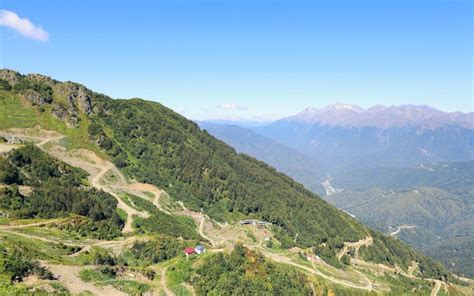 Premium Photo | Landscape of green mountain slope with winding road