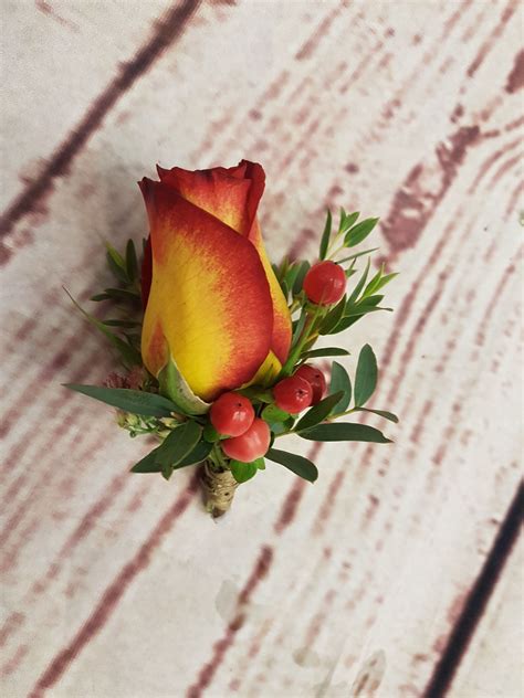 Autumn Buttonhole with Orange and Red Rose