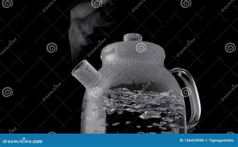 Kettle with Boiling Water and Steam Isolated on Black Background Stock ...