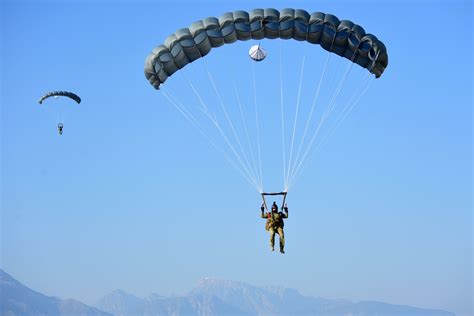 Airmen parachute to their designated landing zone