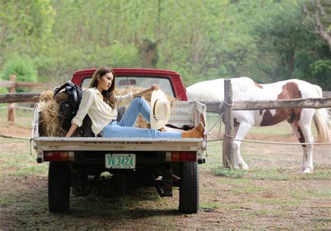 A Woman in a Cowgirl Style Sits in a Horse Ranch with a Western Farm Environment Stock Image ...