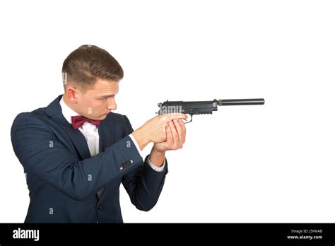 Confident businessman pointing a gun on isolated background Stock Photo ...