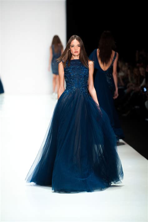 SS15 collection on the runway. Midnight Blue evening gown with embroidered bodice, boat neckline ...