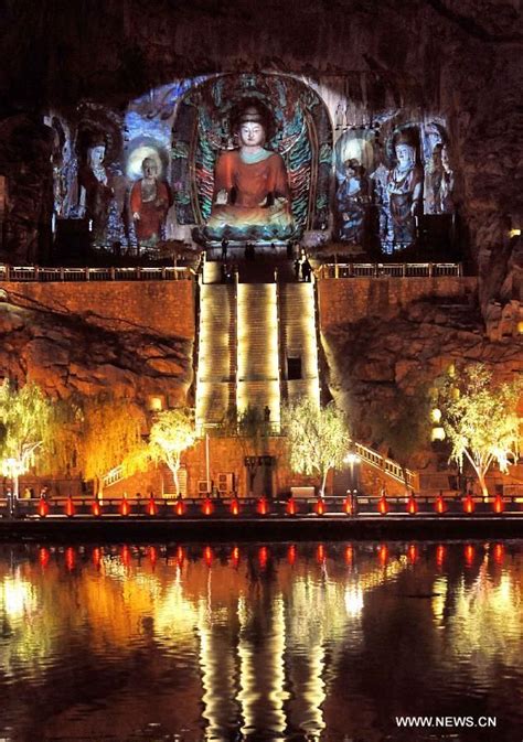 The night tour at Longmen Grottoes, a world cultural heritage site, has ...