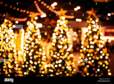 Christmas tree with gold bokeh light background. Xmas abstract blur and ...