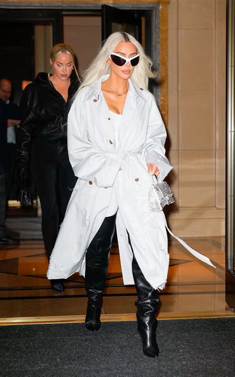 Kim Kardashian's frail frame drowns in baggy trench coat in new photos ...