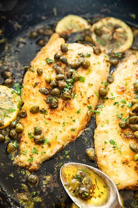 Tender sole fish cooked in a lemon butter sauce with capers. A classic Sole Meuniere recipe that ...