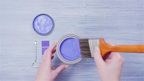 Premium Photo | Metal paint can with purple paint and paint swatches.