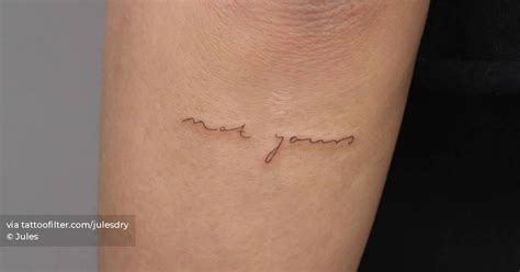 "Not yours" lettering tattoo handwritten on the