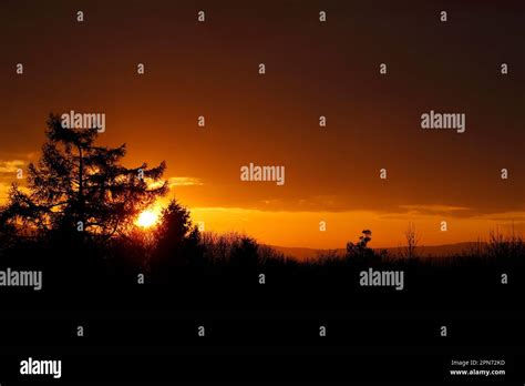 Sunset Silhouette over the countryside in summertime Stock Photo - Alamy