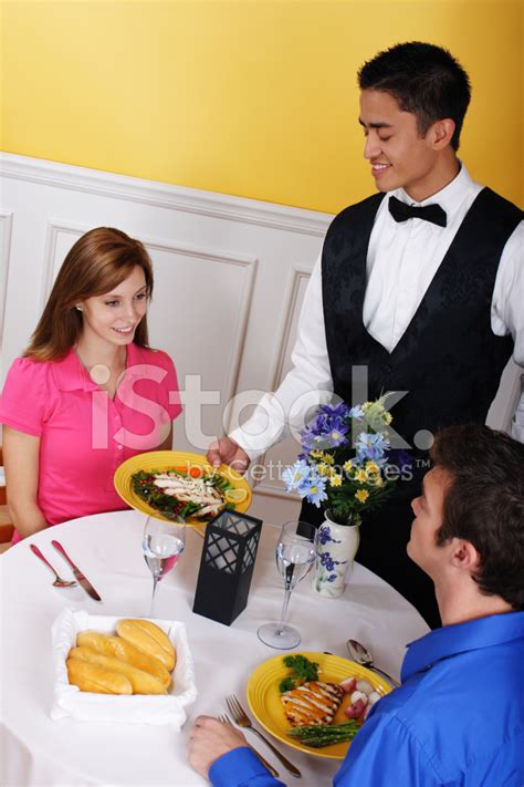 Waiter Serving Food Stock Photo | Royalty-Free | FreeImages