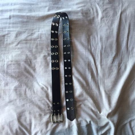 Black belt with silver lined holes Perfect condition black belt with silver lined holes. I am a ...