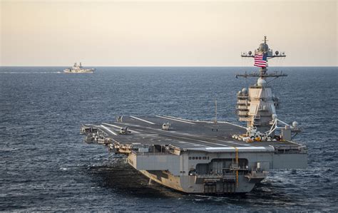 The USS Gerald R. Ford (CVN 78) and the Italian aircraft carrier ITS ...