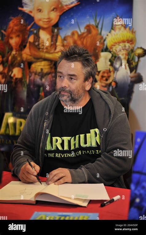 "French film director Luc Besson signs copies of his latest animated film ""Arthur and the ...