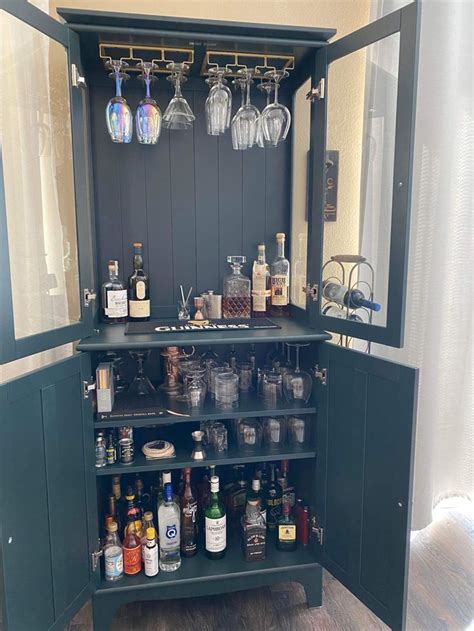 This is the perfect piece for a bar! We omitted the two shelves that go to the glass cabinet for ...
