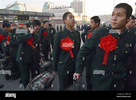 Chinese demobilized soldiers wait to take the train at a railway station in Beijing, China. 04 ...