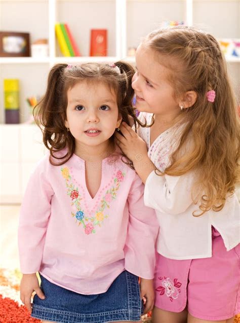 Little Girls Whispering Secrets Stock Image - Image of secret, caucasian: 13441269