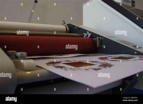 Plastic laminating machine Stock Photo - Alamy