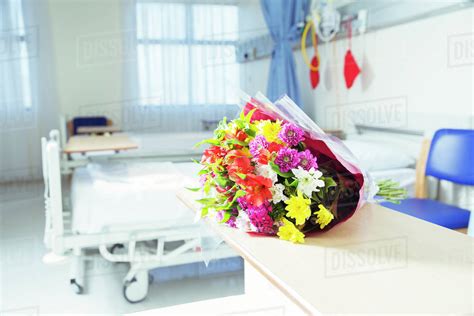 Bouquet of flowers in hospital room - Stock Photo - Dissolve