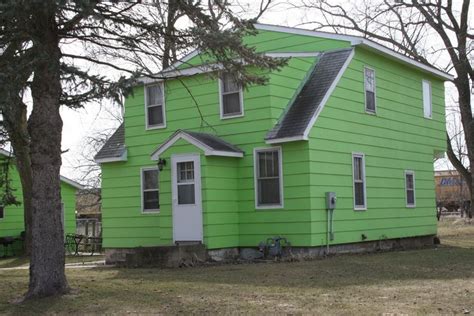 A lime green house | Green house paint, Green exterior paints, Green paint colors