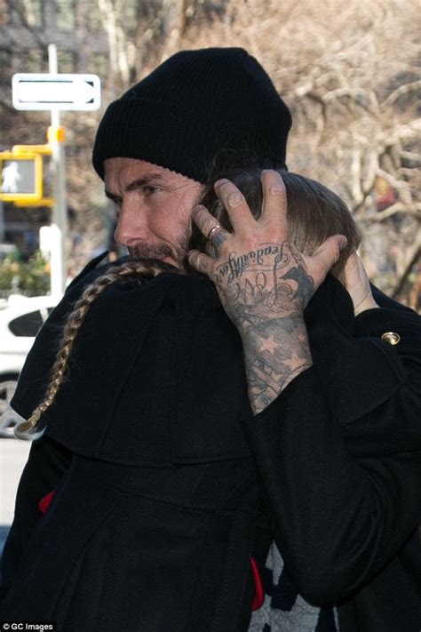 David Beckham shows off new tattoo on wedding ring finger | Daily Mail Online