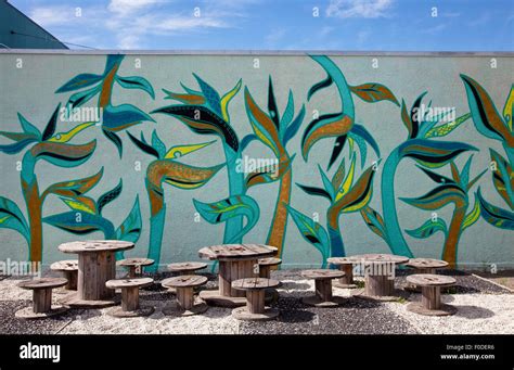 Outdoor cafe with street art mural, Christchurch, New Zealand Stock ...