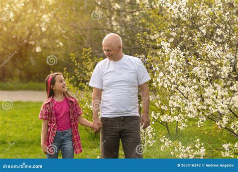 Grandfather and Granddaughter in Backyard Stock Photo - Image of ...