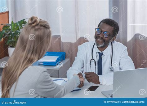 Smiling African American Doctor and Patient Shaking Stock Photo - Image of black, clinic: 119790532