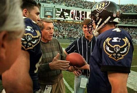 1998 retro photo of Baltimore Ravens quarterback Jim Harbaugh giving ...