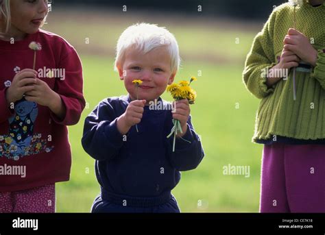 Children playing with flowers Stock Photo - Alamy