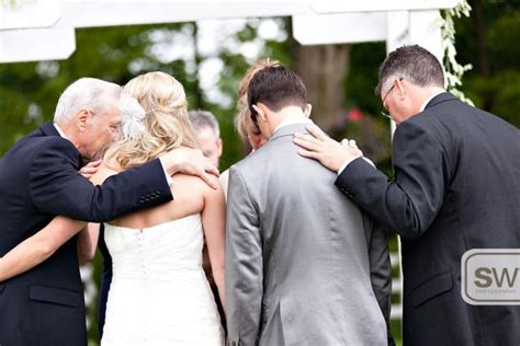 Families Praying at Wedding