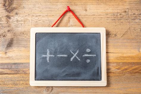 Premium Photo | Math symbols on blackboard with frame wooden wall background