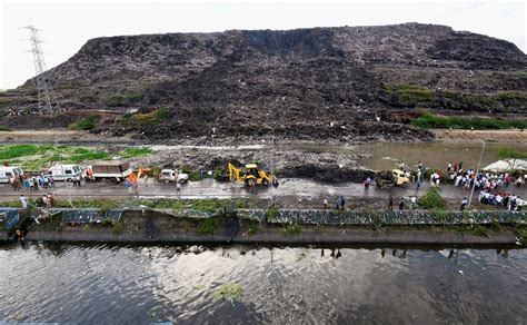 Two killed, several feared trapped after part of Ghazipur landfill ...